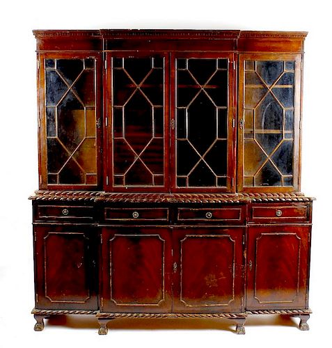 A mahogany reproduction breakfront bookcase cabinet The upper section with dentil cornice over two p