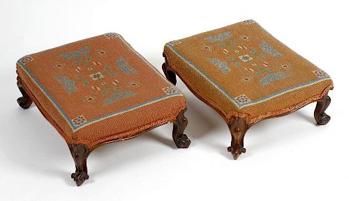 A pair of Victorian tapestry footstools. Each having foliate motif upon a pale pink ground, raised u