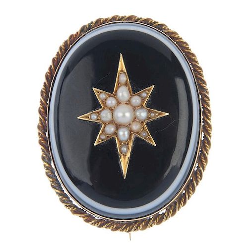 A late 19th century gold split pearl and onyx mourning brooch. The oval-shape onyx cabochon with a s