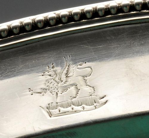 A George III silver meat dish by Paul Storr, the oval form with dual crests, raised edge with beaded