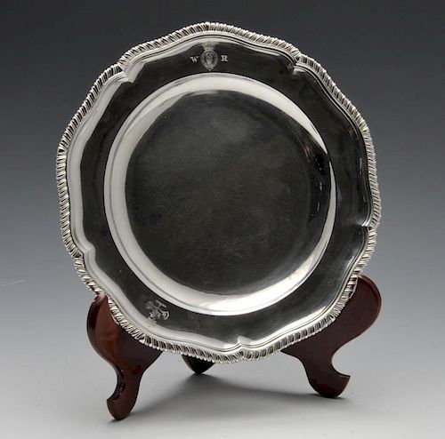 A fine set of twelve George III silver dinner plates, each of shaped circular form with gadroon rim