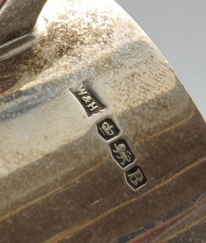 An early twentieth century silver mug of slightly tapering form to a glass base, presentation engrav