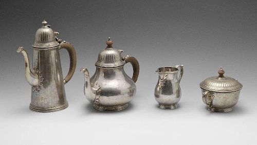 A 1960's silver four piece tea service, comprising teapot, coffee pot, milk jug and twin-handled sug