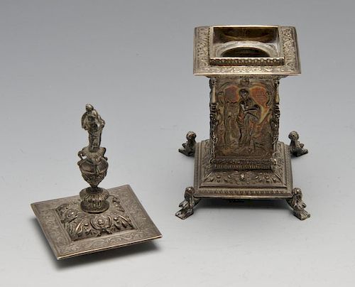 An early twentieth century silver inkwell, the Neoclassical column form embellished with stylised fi