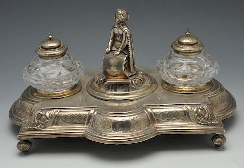 A mid-Victorian silver inkstand of shaped rectangular outline, decorated with a border of foliate mo
