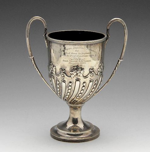 A late Victorian silver twin-handled trophy, lobed and beaded decoration to the lower body with foli