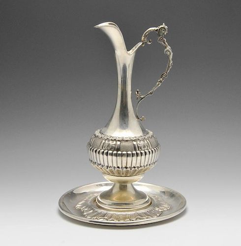 A mid-twentieth century Italian ewer on circular stand, the ewer of bulbous form decorated with lobe