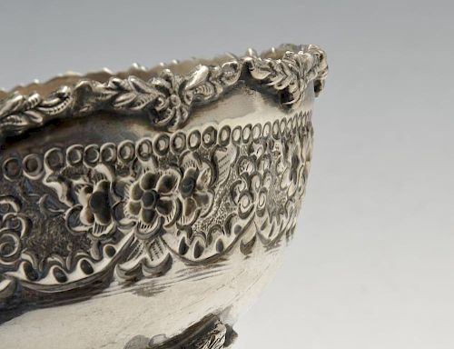 A parcel of continental items to include an embossed circular bowl, marked silver, height measuring