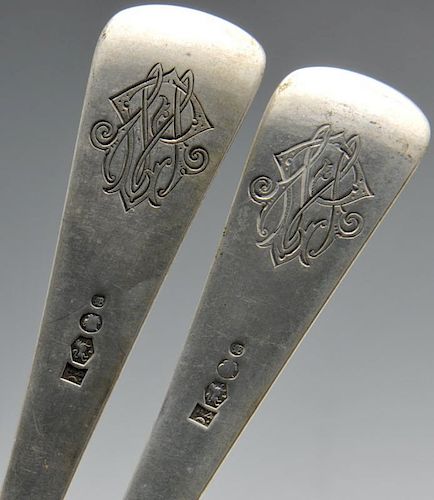 A set of four Dutch silver table spoons, the reverse terminals with monogram engravings. Together wi