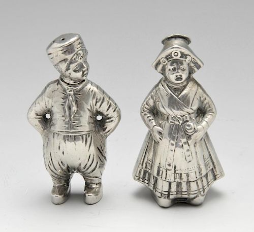 A German silver novelty salt and pepper set, modelled as a male and female in continental dress, Ger