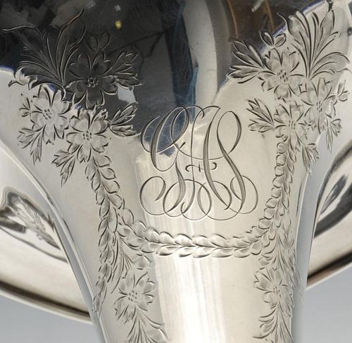 A pair of Tiffany & Co. silver vases, the tapering bodies with floral garland engraving and monogram