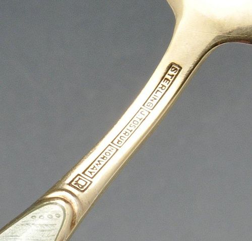 A Norwegian silver-gilt and enamel three-prong fork and spoon, having oval panels of pale green enam