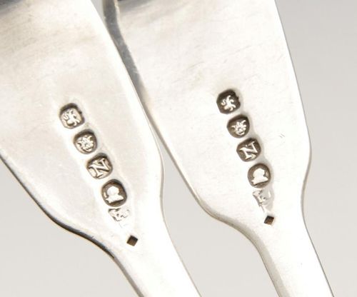 A pair of George III silver sauce ladles, in Fiddle pattern with engraved monograms to terminals. Ha
