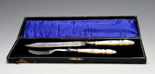 A pair of mid-Victorian mother-of-pearl handled silver servers, the shaped blade having scrolling fo