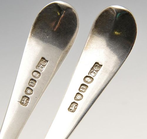 A pair of George III Old English pattern silver table spoons with initialled terminal and extended d
