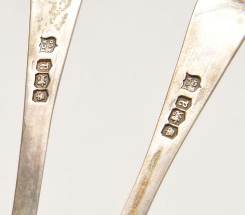 A cased set of six George V silver spoons and sugar tongs, each having floral engraving to the stem.