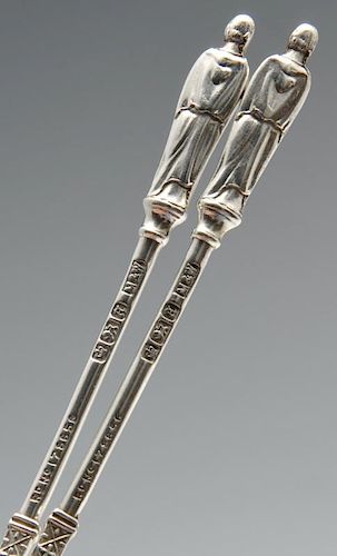 A cased set of six late Victorian silver spoons and sugar tongs having apostle terminals and foliate
