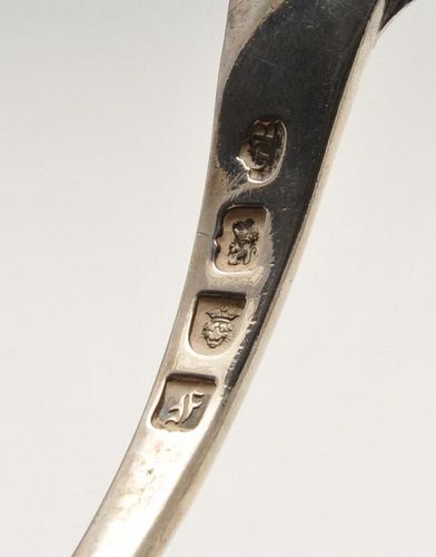 An early George III silver soup ladle with shell and scroll terminal and crest engraving to the reve