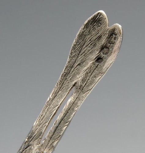 A nineteenth century Dutch silver pepper modelled as a long tailed bird with realistic feather decor