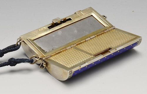 A 1920's Scottish import silver-gilt and enamel minaudiere, the hinged cylindrical body with blue gu