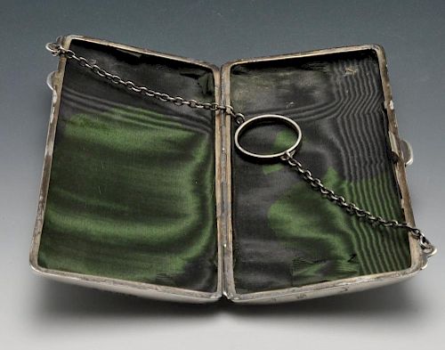 An early twentieth century silver purse or case, the oblong hinged form with reeded decoration, cent