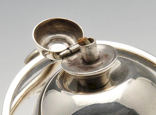An Edwardian silver novelty table lighter, the central globe with domed, hinged lid and gimbal suppo