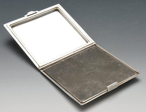A Danish import Art Deco silver compact, of plain square form having stepped reeded edge and conform