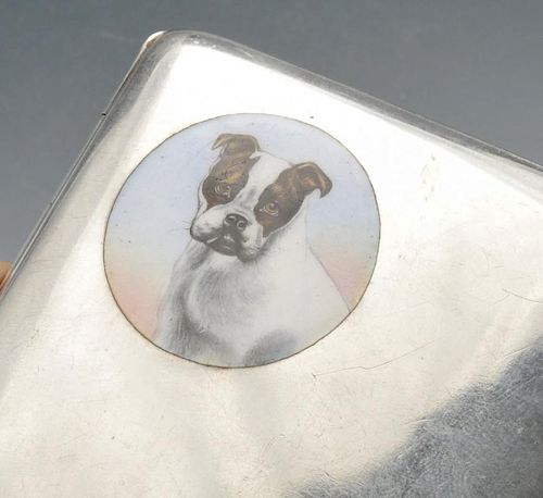 A German silver cigarette case, the plain oblong form inset with a circular enamelled cartouche depi