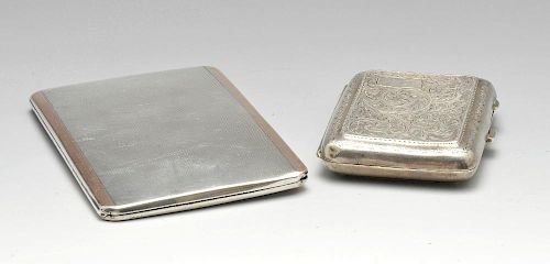A 1920's silver cigarette case of rounded rectangular form, having foliate scroll engraving througho