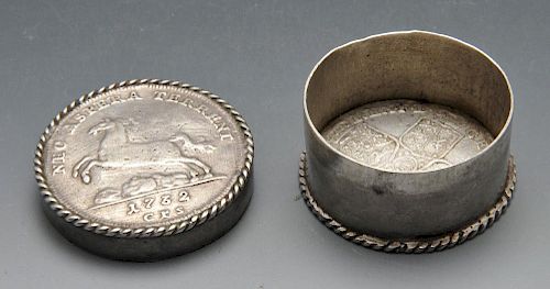 A continental pill or patch box, the circular form with Rope twist border and set with early eightee
