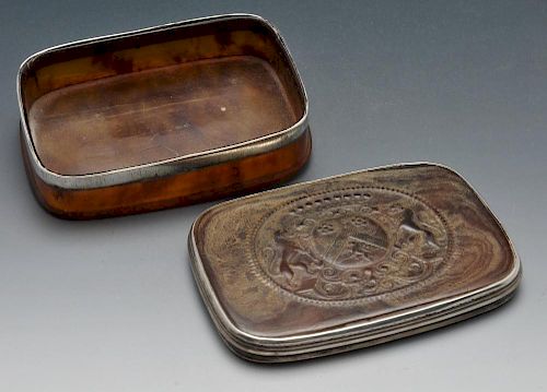 A tortoiseshell box of oblong form with armorial to the detachable cover within white metal reeded m