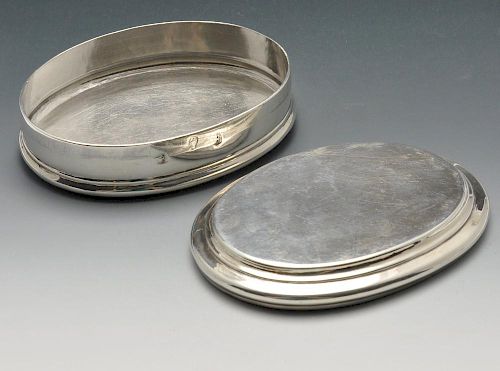 A Queen Anne silver table snuff box, the plain oval form with stepped border. Hallmarked London 1705