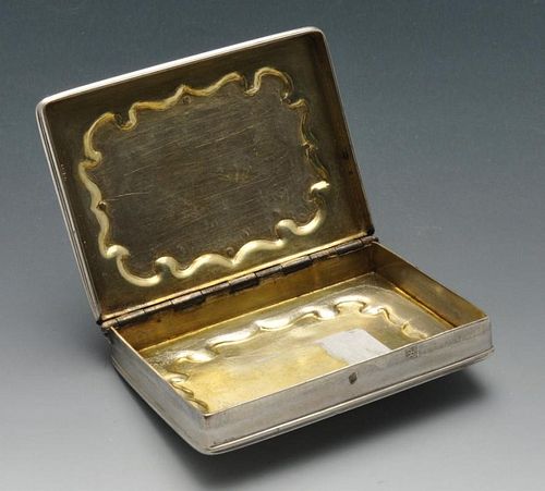 A continental snuff box of rounded rectangular form, the hinged lid with raised panel showing a hunt
