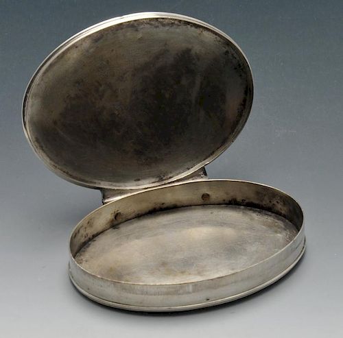 An oval snuff box, probably eighteenth century, the plain slim form with engraved monogram to both h