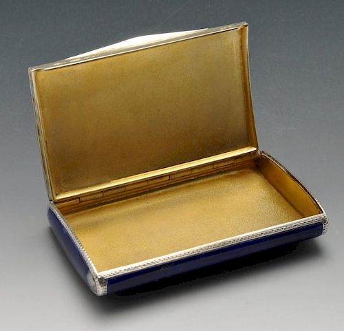 A German silver and enamel snuff box, the curved rectangular form having punched and stippled border