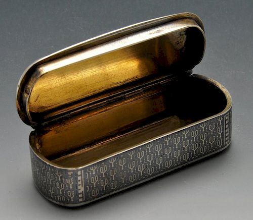 A French silver snuff box, the oblong form entirely decorated in niello with a repeated motif. Frenc