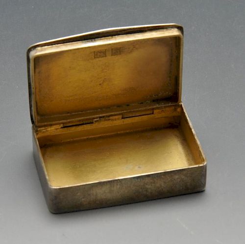 A 1960's silver-gilt small snuff or pill box, having engine-turned panel with central initialled car
