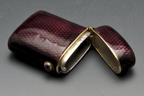 A turn of the century Faberge vesta case, the oblong form with purple guilloche enamel and cabochon