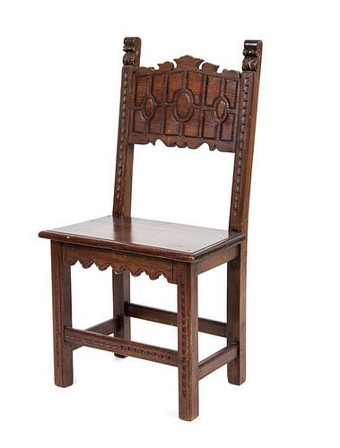A Jacobean Style Walnut Hall Chair Height 39 1/2 inches.
