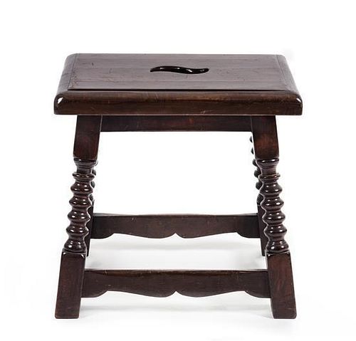 A Jacobean Style Oak Stool Height 17 x width 17 1/2 x depth 14 inches.