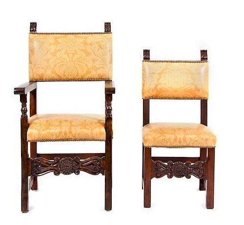 A Set of Fourteen Spanish Baroque Style Walnut Dining Chairs Height of armchair 46 1/4 inches.