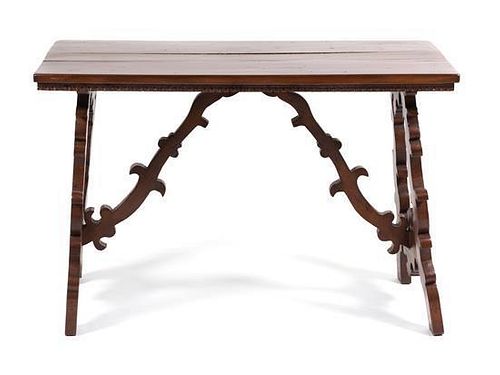 A Spanish Baroque Style Walnut Trestle Table Height 31 x width 47 x depth 24 inches.