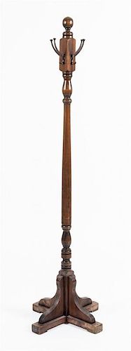 A Mahogany Coat Rack Height 67 1/2 inches.