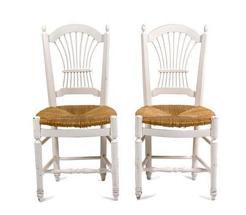 A Pair of White Painted Side Chairs Height 15 x width 15 x depth 35 1/2 inches.