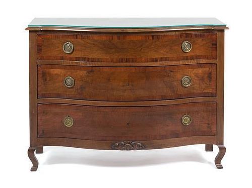 A Continental Walnut Chest of Drawers Height 34 1/2 x width 47 1/4 x depth 20 inches.