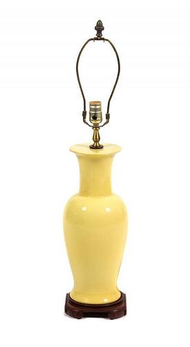A Yellow Glazed Ceramic Vase Height 30 inches.