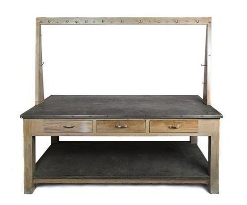 A Metal-Clad Kitchen Work Table Height overall 73 1/4 inches x width 83 7/8 inches x depth 37 1/2 inches.