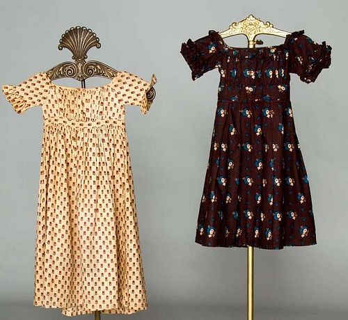 TWO LITTLE GIRLS' CALICO DRESSES, 1810-1825