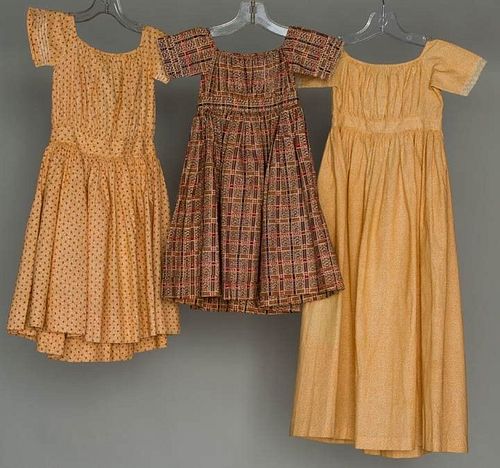 THREE TODLERS' CALICO DRESSES, 1830-1850