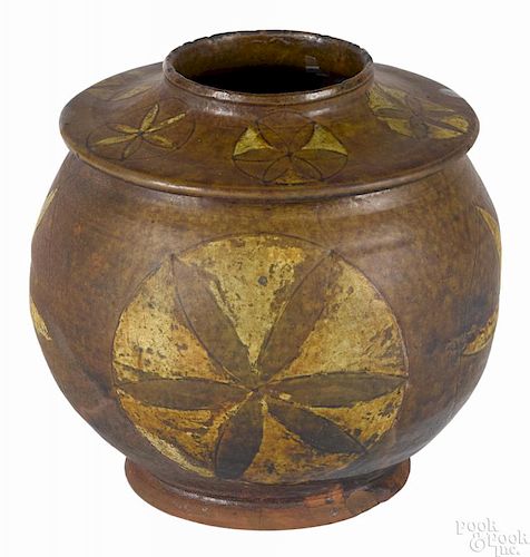 Pennsylvania redware jar, ca. 1830, with incised yellow slip star decoration, 7 1/2'' h.